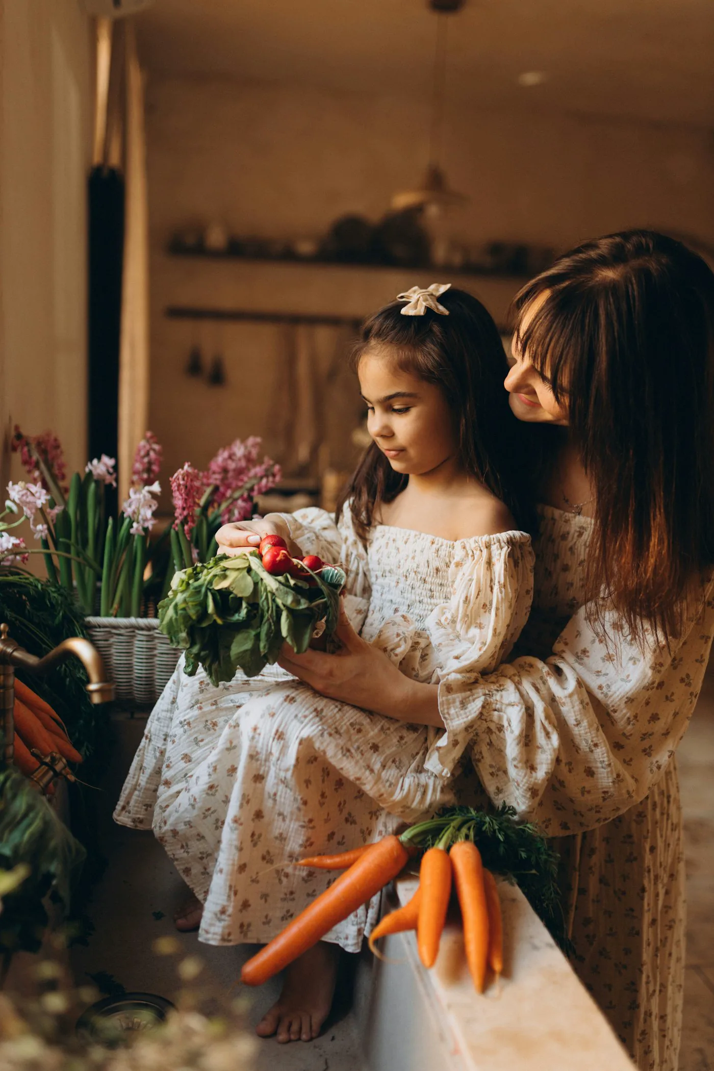A mother and daughter preparing fresh vegetables together
