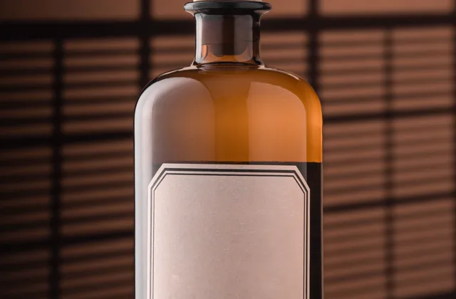 Amber glass bottle with a blank label