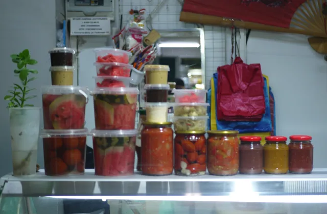 Jars and containers of preserved food arranged on a shelf