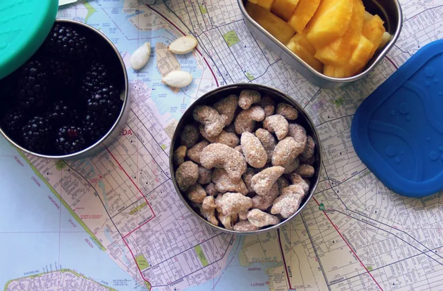 A reusable lunch container packed with fresh fruit