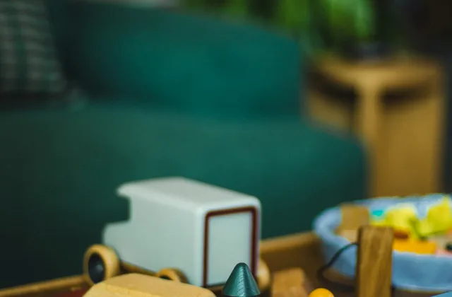 Wooden toys and books arranged on a coffee table